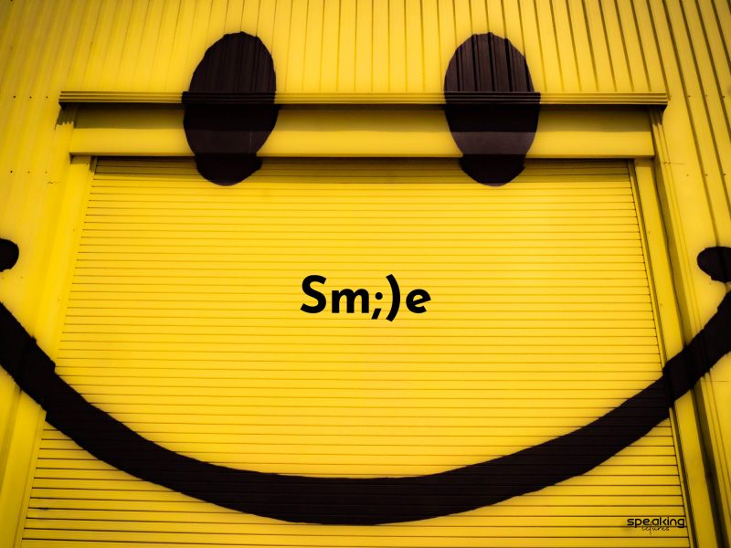 yellow garage with smiley