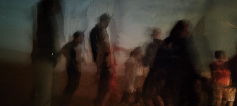 Dancing group in night in Red dunes, Saudi Arabia